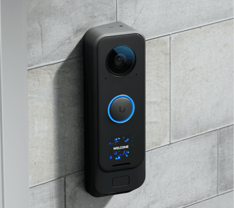 A smart video doorbell installed next to a front door